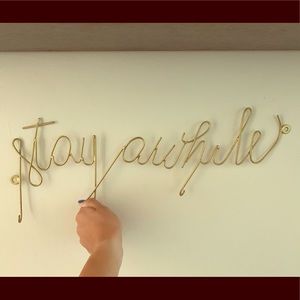 Urban Outfitters ‘Stay Awhile’ sign